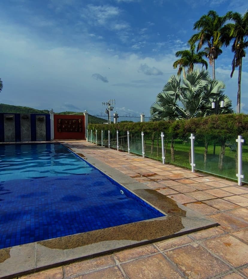 Picture of a pool in a beautiful green place
